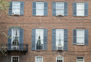 Black Shutters on Old Brick Building