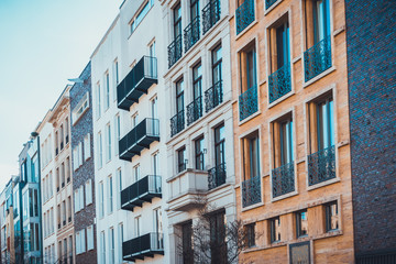 Fototapeta na wymiar Row of buildings with multiple toned facades