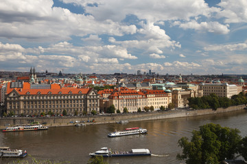 Pleasure boats on the Vltava river near embankment Dvorak. Prague