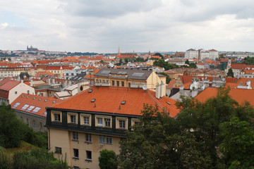 Fototapeta na wymiar Nice view of the city of Prague. Old houses with red roofs 