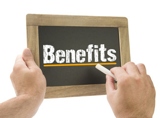 Hand writing Benefits on chalkboard
