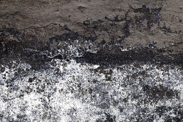 Wall fragment with scratches and cracks