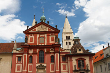Fototapeta na wymiar Facade of St. George's Basilica (Basilika sv. Jiri) at Prague Castle 