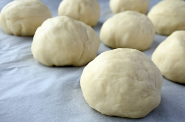 Fototapeta na wymiar Close up view of round pieces of dough Bread Rolls