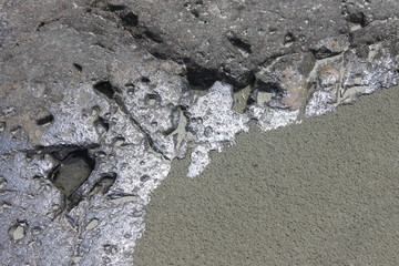 the texture of the stone and sand on the river Bank