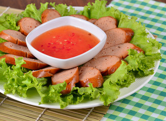 tasty grilled meat sausages on dish