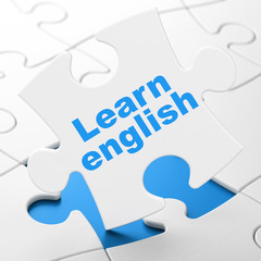 Learning concept: Learn English on puzzle background