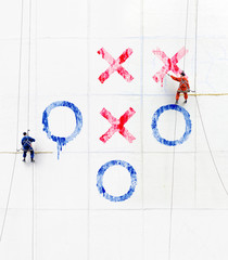working figures climbing  a  wall