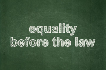 Obraz premium Political concept: Equality Before The Law on chalkboard background