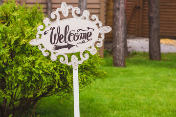 Handmade wooden board with welcome sign. Wedding. Reception.