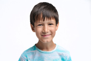 Portrait of a smiling boy on a white background