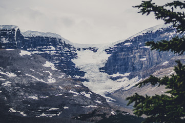 Avalanche on rough rocky mountains