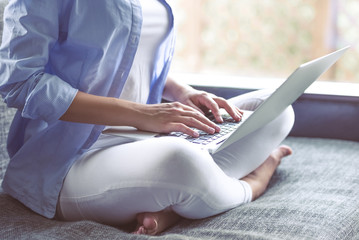 Naklejka premium Beautiful girl with gadget at home