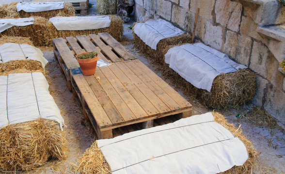 table and chair made of straw Roman style