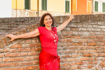 mature woman in typical town in Italy