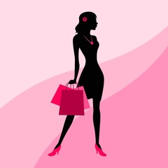Silhouette of a woman with shopping bags