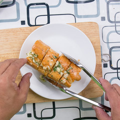 Chef put sausage bread to plate
