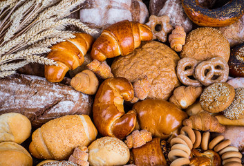 fresh bread and wheat on the wooden