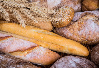 fresh bread and wheat on the wooden