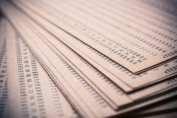 Abstract numbers printed on old brown paper macro shot