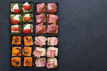 antipasti spanish tapas on dark slate