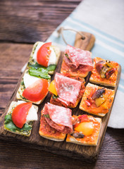 antipasti tapas served on wooden board