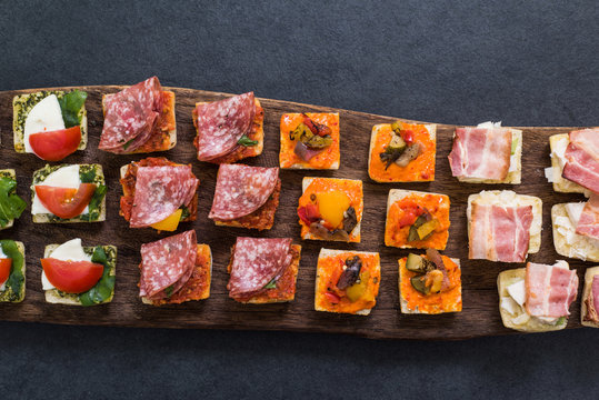 traditional antipasti snack on wooden board