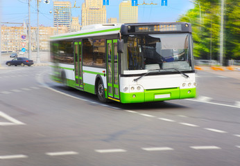 city bus goes along street