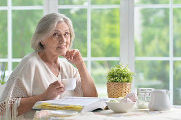 Senior woman with book 