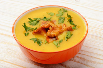 Vegetarian cuisine - cream soup with potatoes and chanterelles mushroom.