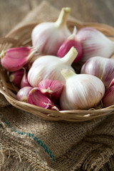 fresh garlic on wooden surface