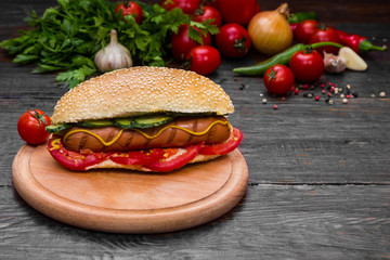 Hot Dog on a tray with a background of vegetables