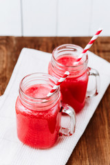 Healthy watermelon smoothie on a wood background. Freshly blended watermelon Smoothies.