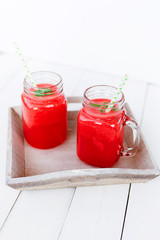 Healthy watermelon smoothie on a wood background. Freshly blended watermelon Smoothies.