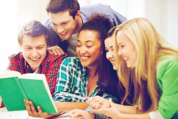 students reading book at school