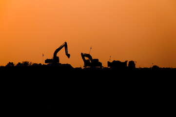 silhouette of excavator loader at construction site,Silhouette Backhoe,track-type loader excavator...