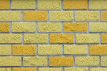 Empty   yellow  brick wall textured background.