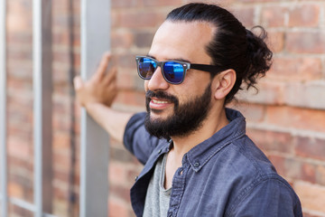 happy smiling man with beard on city street