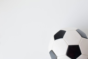 close up of football or soccer ball over white