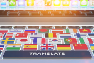 Languages translation concept, online translator, close-up view of computer keyboard with national flags of world countries on keys and translate button