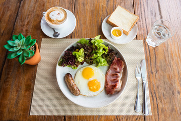 American breakfast on wooden table