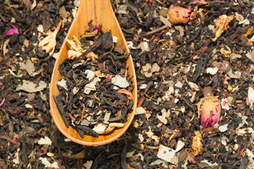 Close up of dry tea in wooden spoons.Selective focus
