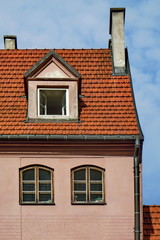 Fototapeta na wymiar Red roof and dormer (Riga, Latvia) 