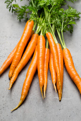 Fresh carrots on the gray backgrounds.