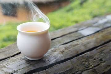 hot green tea on wood table