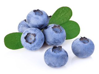 Fresh ripe blueberries with leaves close-up isolated on a white background.