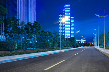 city empty traffic road with cityscape in background