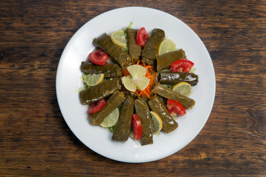 Stuffed vine leaves. Dolma is a family of stuffed vegetable dishes common in the Middle East and surrounding