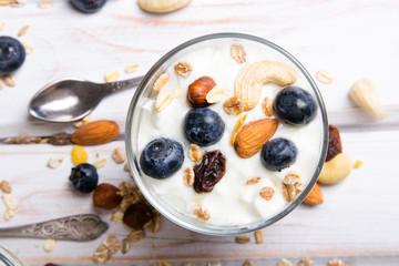Healthy dessert with yogurt, nuts, oats and blueberries