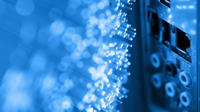 human plugging in and out Ethernet cable, with Fiber optics backgrounds, shot in HD